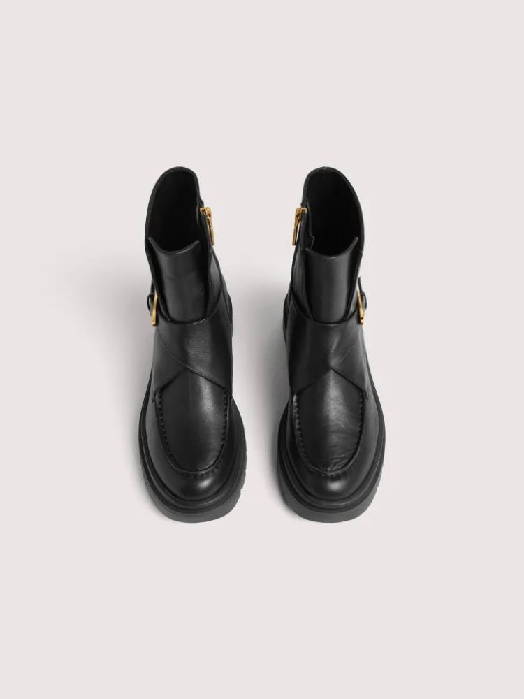 COCCINELLE BOTAS PRETAS COM FIVELA DOURADA